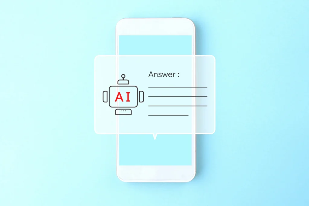 スマホ画面にAIチャットボットのアイコンと「Answer:」の文字